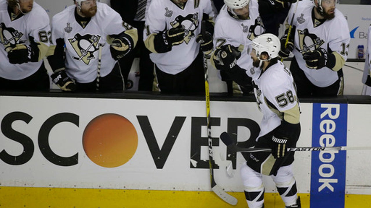 The Latest: Letang, Couture score, Penguins lead Sharks 2-1